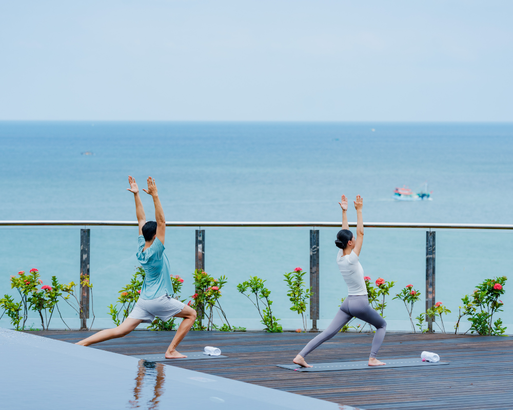 Welcome the day with a sunrise yoga session overlooking the ocean at WorldHotels Long Beach Resort Phu Quoc.